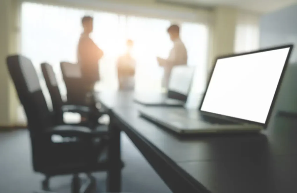 Jaka jest różnica między National Minimum Wage a Living Wage? business concept with copy space office desk table with pen focus analysis chart computer notebook cup coffee desk vintage tone retro filter selective focus