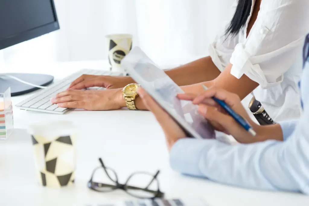 two business woman working office with digital tablet two business woman working office with digital tablet